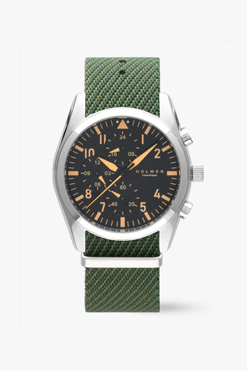 Wristwatch with green strap and black dial on a white background