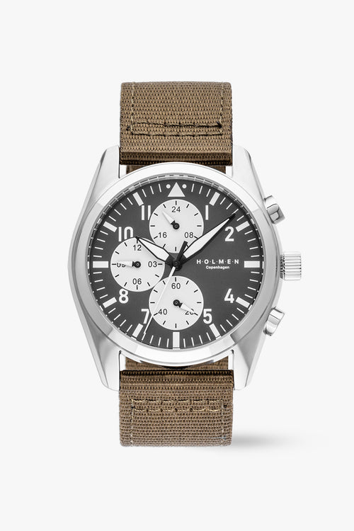 Watch with brown strap and black dial on a white background