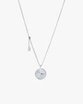 Silver compass necklace with light grey  background