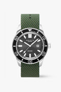 Watch with green strap and black dial on a white background