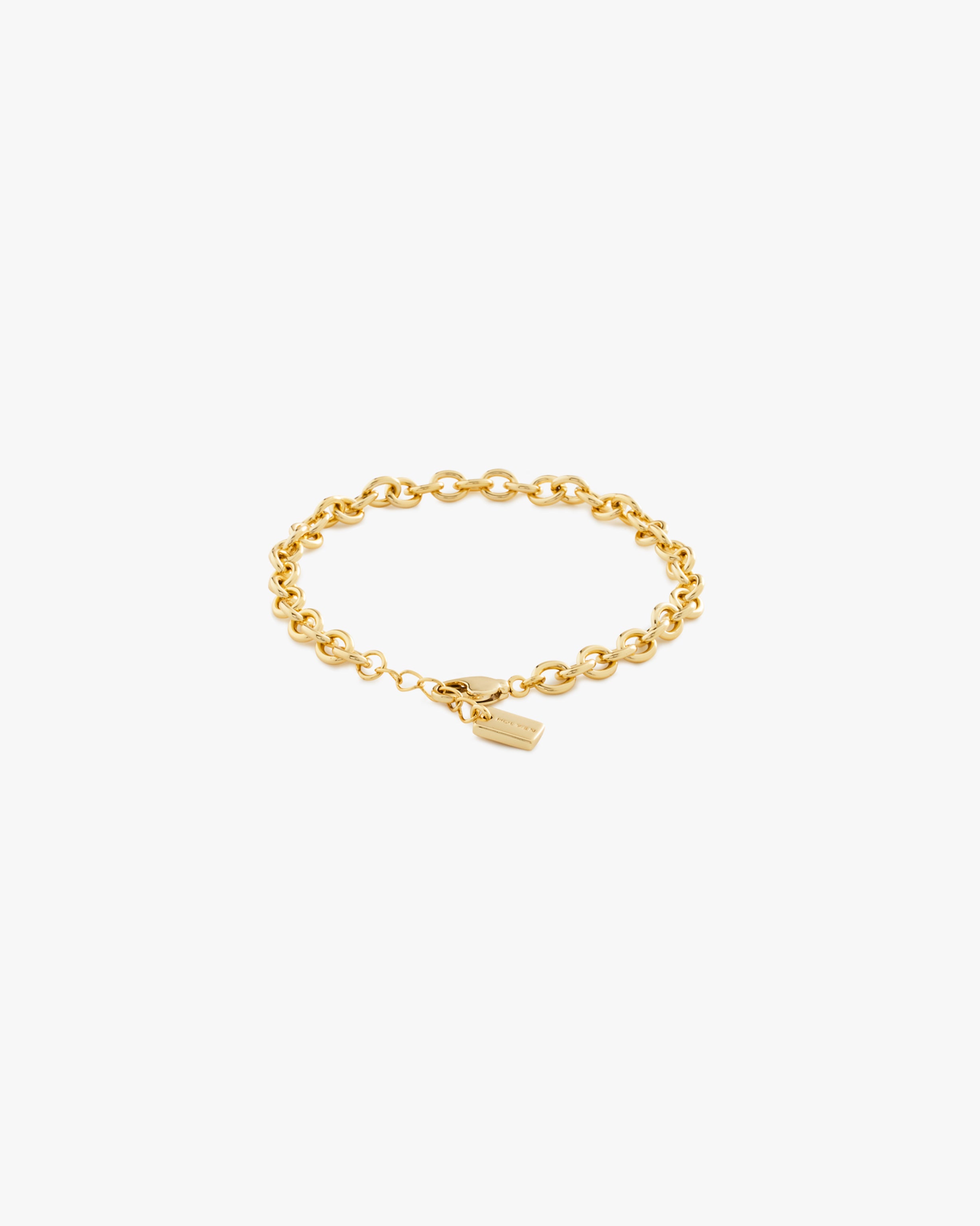 Gold chain bracelet on a light grey background