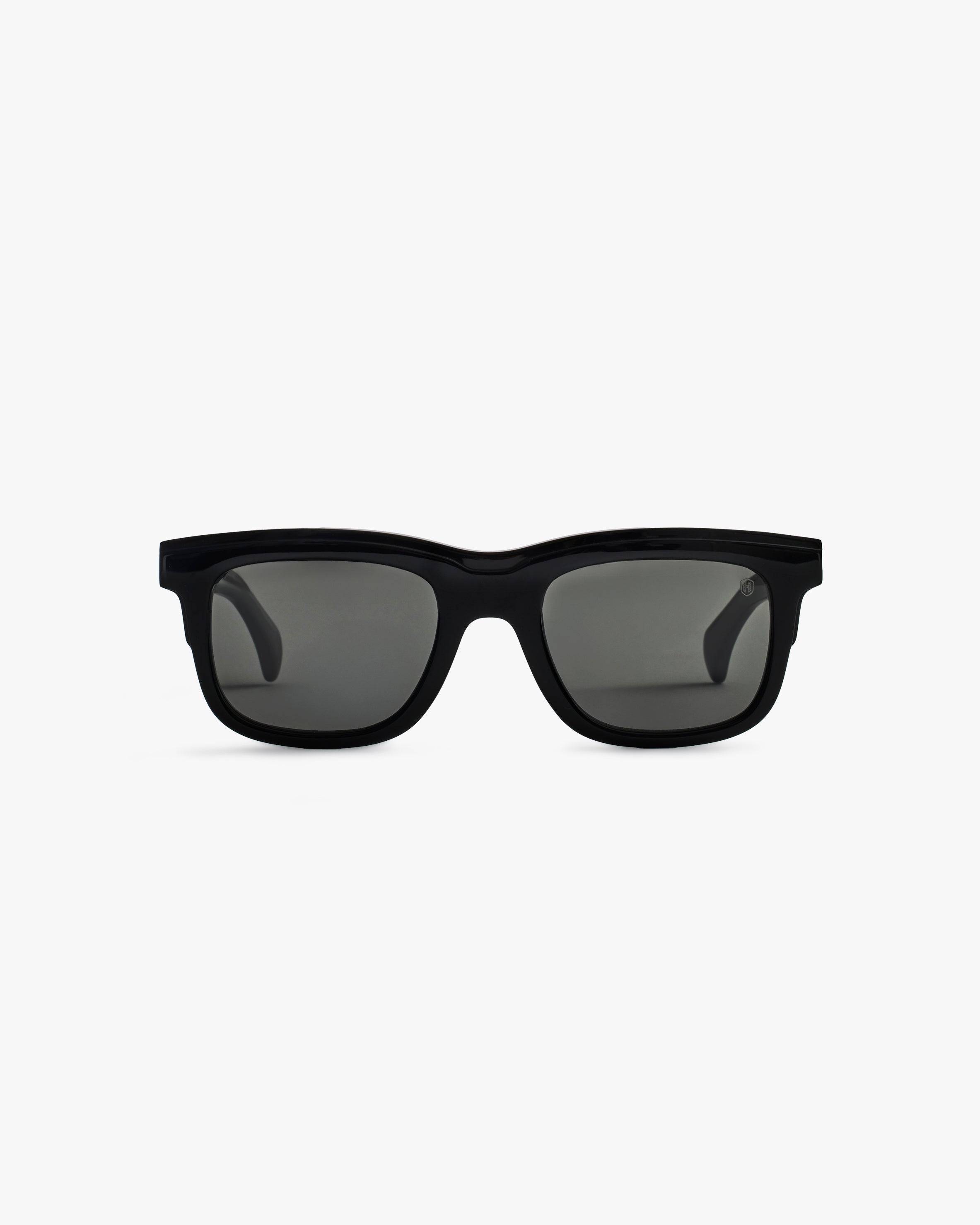 Black sunglasses on a light grey background