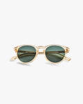 Gold-framed sunglasses with green lenses on a light grey background